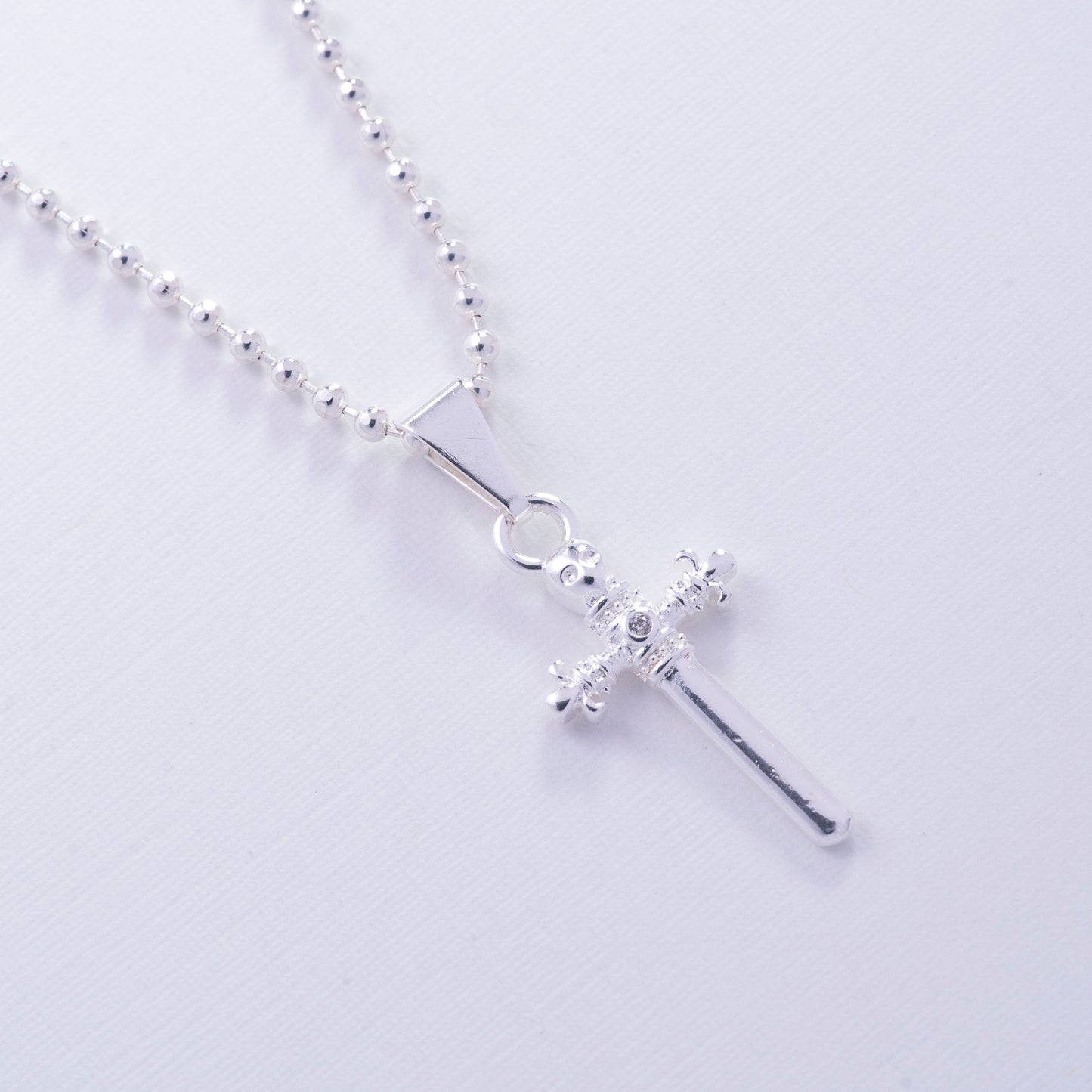 Dije de espada en Plata