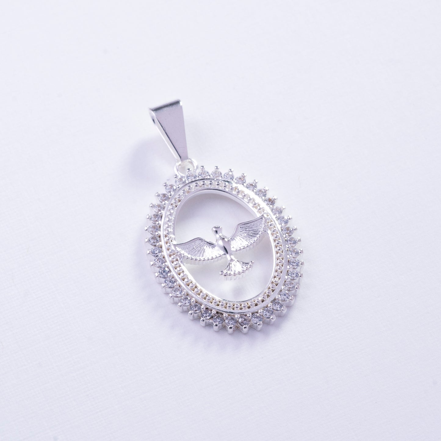 Dije ovalado de fénix con circones en Plata