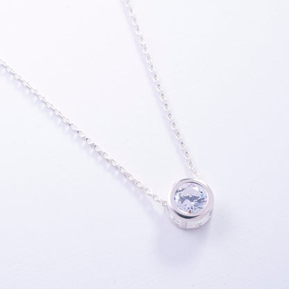 Dije punto de luz engastado en Plata