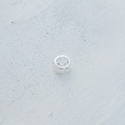 Dije punto de luz engastado en Plata