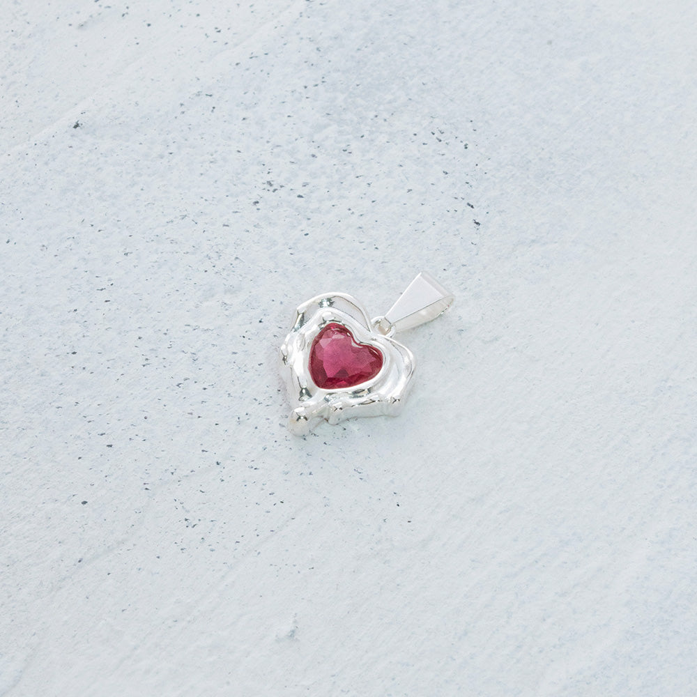 Dije de corazón derretido en Plata