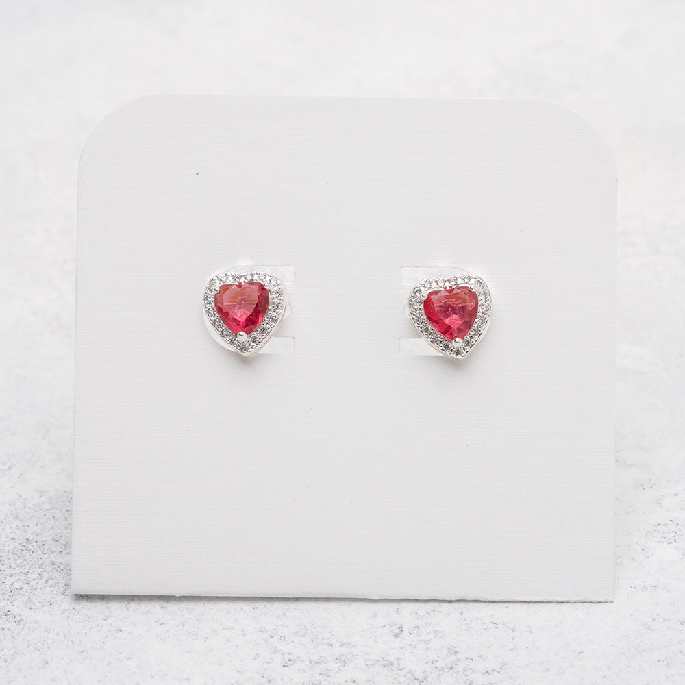 Aros de corazón fucsia en Plata