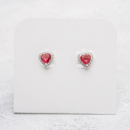 Aros de corazón fucsia en Plata