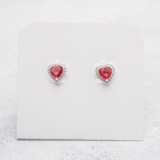 Aros de corazón fucsia en Plata