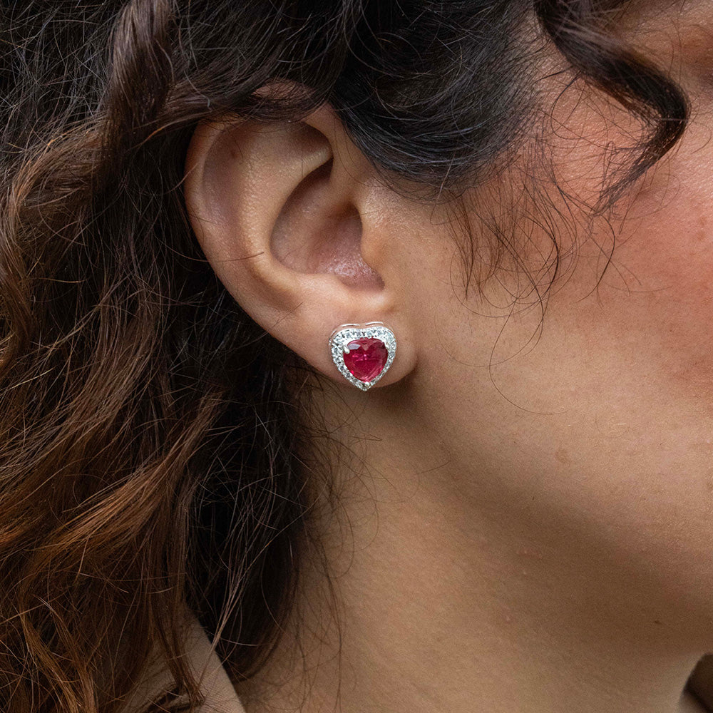 Aros de corazón fucsia en Plata