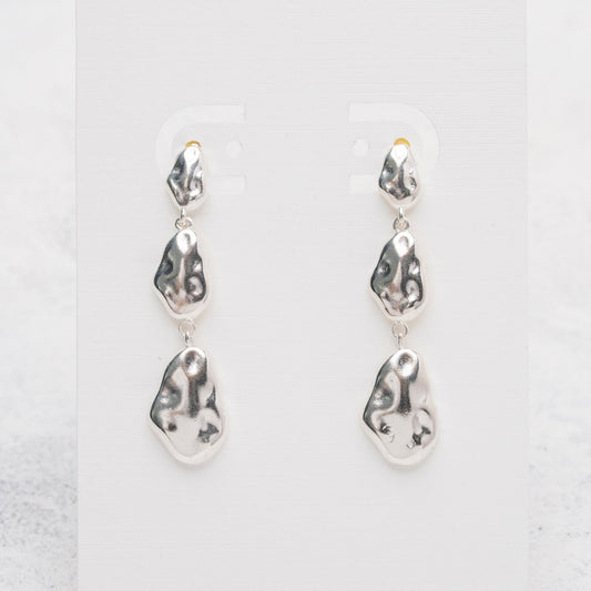 Aros de gotas irregulares en Plata